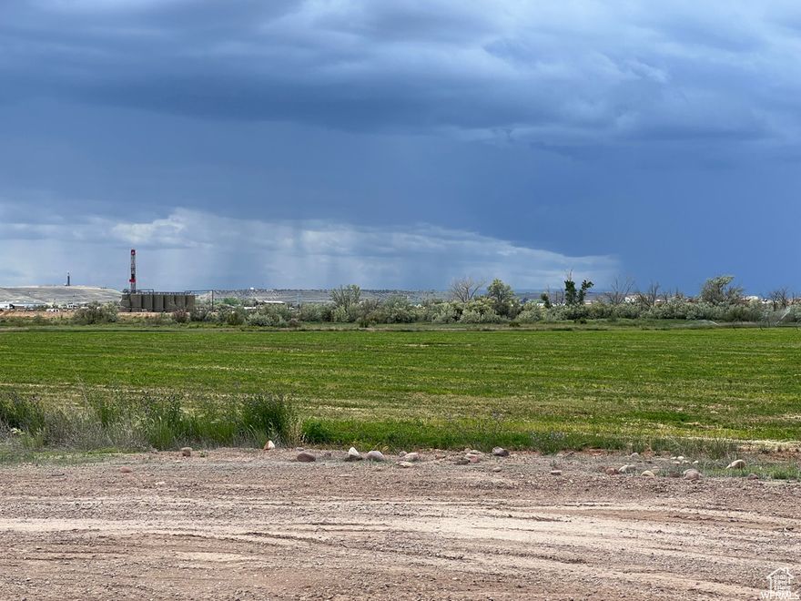 Development land west of stone gate subdivision. 67.40 acres with 20 shares class D Dry Gulch water. Located in Roosevelt City limits, Roosevelt City water and sewer available. Land currently being farmed and leased. Entrance to property off south cove road and can have future road entrances from stone gate subdivision off 440 south and also 2200 west.