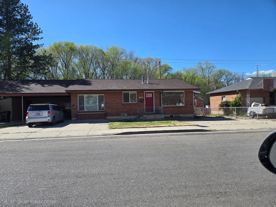 Large home with parking for 3 cars 1 covered, newly remodeled 2-bedroom up 2 down, family room on both floors. nice yard backs to Hobble Creek. washer dryer hookups in the basement