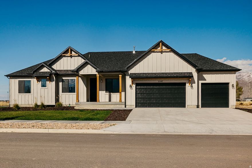 WELCOME HOME! This gorgeous 5-bedroom, 4-bathroom farmhouse-style rambler nestled in one of Spanish Fork's most sought-after custom neighborhoods, where every home is uniquely designed - no two alike! Boasting 4,727 square feet of beautifully crafted living space on a 0.36-acre lot, this residence offers the perfect blend of luxury, comfort, and natural beauty. Step inside to discover an open and spacious floor plan filled with natural light from huge upgraded windows, showcasing breathtaking mountain views. The gourmet kitchen is a chef's dream with high-end finishes, premium appliances, a massive walk-in pantry, and a large dining area ideal for gatherings. The inviting great room features an open concept with a stunning fireplace and flows seamlessly to the covered patio, perfect for relaxing or entertaining while taking in the serene surroundings. Each bedroom is generously sized, with large walk-in closets, providing plenty of space for everyone. The finished basement nearly doubles your living space, offering a huge recreation area, two additional bedrooms, and a full bathroom - perfect for guests, entertaining, or family activities.This home has been meticulously designed with over $199,000 in upgrades, offering an elevated living experience inside and out. Enjoy spacious living, quality craftsmanship, and thoughtful details throughout. Located just minutes from freeway access and major retail shopping, yet surrounded by beautiful farmland and open space, this home offers the best of both worlds - convenience and tranquility.