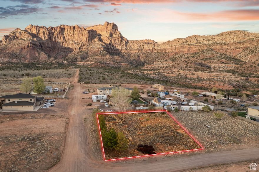 Don't miss this rare opportunity to own a flat, half-acre lot with unobstructed views of the breathtaking red cliffs that define this area. Perfectly positioned in a new and growing neighborhood, the property is surrounded by beautiful new homes and features mature trees along one side-offering both character and natural privacy. All utilities are available to the lot line, making it easy to start building your dream home right away. With the incredible views, prime location, and ready-to-build setup, this lot offers the best of both convenience and natural beauty. Seller will entertain any resonable offer. Water meter on lot. Water fee has been pd. Balance of sewer hookup is $3000 plus $150 installation fee. This equals estimated $14,000 savings to the Buyer.