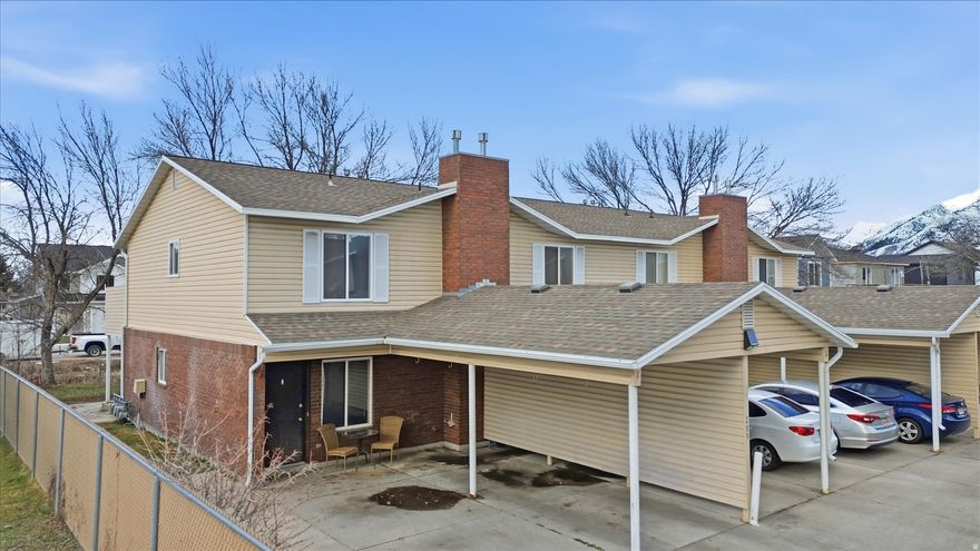 Affordable and centrally located townhome in Meadow Village! This end-unit offers 2 bedrooms, 1.5 bathrooms, and 1,044 sq ft of great living space. Main level features a spacious living area, functional kitchen with peninsula seating, and convenient half bath. Upstairs you'll find two generously sized bedrooms and a full bathroom.  Private patio space, covered carport parking, and additional uncovered parking. Full landscaping is maintained, and the HOA covers maintenance and snow removal for easy living. Built in 1995 and situated in a well-established Logan neighborhood close to schools, parks, shopping, and USU.  Whether you're a first-time buyer, investor, or looking to simplify, this is a great opportunity at an attractive price point.
