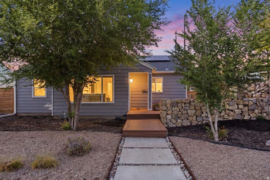 This home is truly going to knock your socks off! Beautifully updated from top to bottom, every detail was thoughtfully designed to create a space that feels both stylish and inviting. From the moment you pull up, the tastefully xeriscaped front yard sets the tone. As you approach the front door, the spacious front deck immediately catches your eye - and trust us, you'll be spending plenty of time there. Step inside and instantly feel at home. The bright and open living area is filled with natural light and highlighted by a stunning wood-paneled accent wall that adds warmth and character. The beautifully updated kitchen is a dream space for cooking and gathering, featuring gorgeous cabinetry, stainless steel appliances, open shelving, and large windows that make the entire room feel airy and welcoming. The open-concept layout keeps everyone connected, making entertaining effortless. The primary suite offers a beautifully designed en suite bathroom that perfectly blends style and functionality. Downstairs, the spacious family room creates the ultimate hangout space with a built-in bar, room for a game table, and plenty of space for cozy movie nights or entertaining guests. The basement also features an additional gorgeous bathroom and an oversized bedroom. And now, back to that deck... This outdoor oasis was designed for relaxing and entertaining alike. Surrounded by fabulous rock walls that create both privacy and ambiance, it's the perfect setting for summer evenings with friends and family. Gather around the firepit for s'mores and conversations that last long into the night. Additional highlights include a garage with extra storage or workshop space, ample driveway parking, and fully paid-off solar panels that help keep electric bills low. Located just minutes from downtown Sugar House, shopping, dining, and entertainment, this home truly checks every box - and then some!