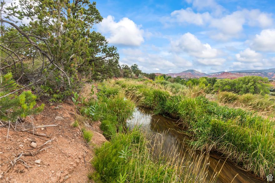 Nestled in the heart of one of Utah's most breathtaking landscapes, this 1-acre slice of paradise in Torrey is more than just land-it's a front-row seat to nature's masterpiece. Picture yourself waking up to fiery red rock cliffs glowing at sunrise, a panoramic view so dazzling it looks like it was painted by the desert sky itself. This isn't just a view-it's a living canvas that changes by the hour, with shadows and colors shifting in the most magical ways. Opportunities like this don't come often. One acre. Endless views. With water running through it. It's not just land-it's your dream backdrop waiting to be claimed.