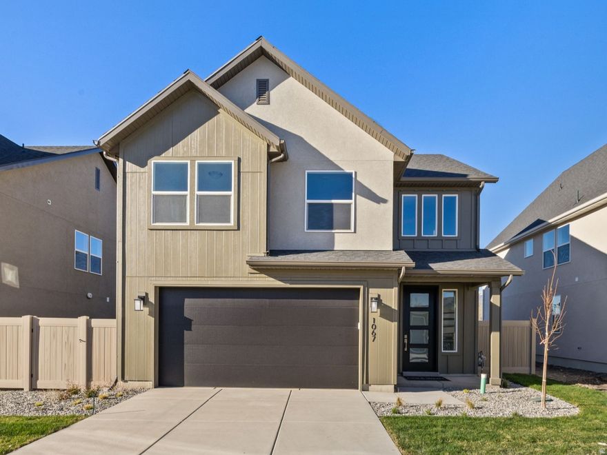 Discover the Swiss 2 Urban plan at theAUDREY-where modern design meets thoughtful functionality in the heart of Woods Cross. This quick-move-in home offers 3 bedrooms, 2.5 baths, and 2,109 sq. ft. of expertly crafted living space. Enjoy open-concept living with a spacious kitchen, stylish finishes, and a light-filled great room perfect for hosting or relaxing. Upstairs features a generous primary suite, convenient laundry, and additional bedrooms with flexible use options for work or play.  With its clean elevation, curated interior selections, and ideal location near shopping, dining, parks, this home blends elevated living with everyday convenience. Experience inspired architecture, modern comfort, and the lifestyle you've been searching for-welcome home to theAUDREY.