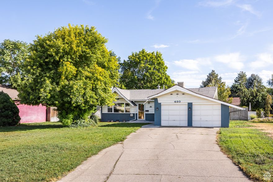 Located in South Salt Lake on the cusp of Millcreek, this adorable home has a bit of everything for anyone seeking an affordable starter with a LOT of potential. With features that entail a few different property styles-mid-century in era with some cottage, bungalow, and rambler details thrown in for good measure-what you'll find in no short supply here is comfort and possibility. There's an endearing 50s vibe here: a whimsical roofline feels reminiscent of a gingerbread house, and the huge lot size is highly enviable. A big front yard means the property is set back from the road, creating plenty of privacy, and a roomy two-car garage lends itself to just the right amount of storage for both your vehicles and your *stuff*. Inside, the spaces feel bright, open, and seamlessly connected to one another. A stone fireplace offers warmth in the colder months, and the kitchen (which could use updating, but is in fantastic condition) is centrally located in the home, all but guaranteeing successful gatherings. Bedrooms are ripe with possibilities, and an en-suite half-bath could easily be turned into a full bath with a little work (plus, the windows and furnace in the home are on the newer side). A sizable porch off the back of the property walks out to a large back yard where you have the opportunity to create your dream outdoor space. A small shed in the center of the lawn offers up the perfect covered sitting area (we're envisioning string lights and a dining table or cozy furniture), and a much larger shed in the back means you'll have room for every last yard tool and mower (or you can create your own art studio, growing shed, office, etc.). Plus, a small fenced area makes the perfect spot for a dedicated garden. All told, this lovely home has been well-loved and -taken care of...and it's time for the next owners to do the same.