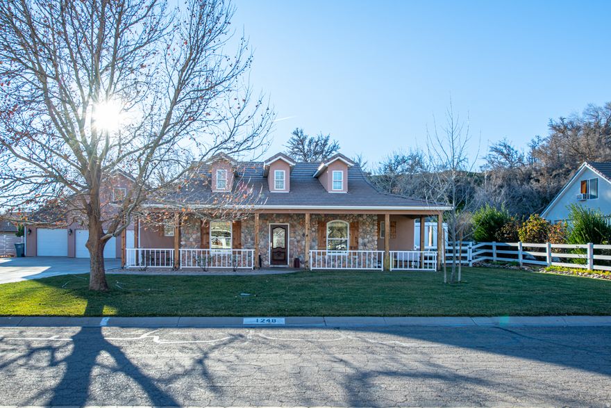 Updated Toquerville home with guest or multigenerational living! Main home features 3 beds and 2 baths, plus a separate 1 bed / 1 bath apartment above the garage with a full second kitchen. Highlights include hardwood floors, custom built-ins, gas fireplace, kitchen nook, built in office desk & drawers, Murphy bed, and abundant storage. Enjoy a private fenced backyard with shade trees, covered patio, jacuzzi, BBQ gas stub, shed, and irrigation water. RV parking, huge level driveway, oversized 3-car garage with 220V, solar panels for low electric bills, extra attic insulation, and new water softener (Jan 2026). Nearby path along the creek that takes you to the park. HOA prohibits any kind of rentals.