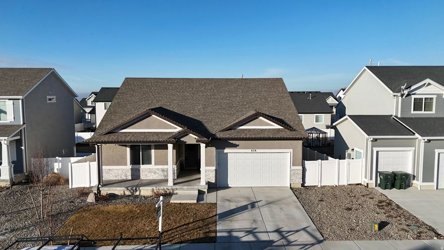 Welcome to this beautifully built 2023 home located in the growing community of Tooele. Designed with both comfort and functionality in mind, this residence offers 3 bedrooms, 2 full bathrooms, and an impressive 3,731 sq ft of living space on a .16-acre lot. The open and spacious layout provides flexibility for everyday living and entertaining, with abundant natural light and modern finishes throughout. Generously sized bedrooms and well-appointed bathrooms create a sense of ease and balance, while the newer construction offers peace of mind with updated systems and energy efficiency. Situated in a quiet residential area, this home delivers the best of both worlds-a calm, spacious environment with convenient access to parks, schools, local amenities, and I-80, making commuting to Salt Lake City simple and efficient.  Buyer is advised to obtain an independent measurement.