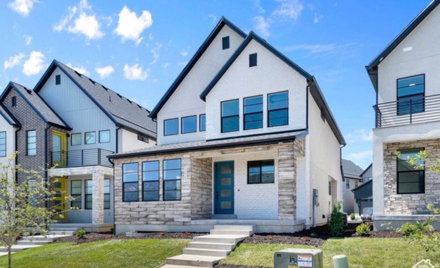 This brand new Stockholm cottage home combines modern finishes with practical design. Enjoy laminate hardwood, tile, and carpeted flooring throughout, along with can lighting, Christmas light outlets, and energy-efficient upgrades. The kitchen features modern white laminate cabinets, quartz countertops, stainless steel gas appliances, and a stylish tile backsplash. The owner's suite includes quartz shower surrounds and striking black matte hardware. Finishing touches like metal stair railings and Craftsman-style base and casing add charm and sophistication. Comes fully landscaped that is maintained by the HOA