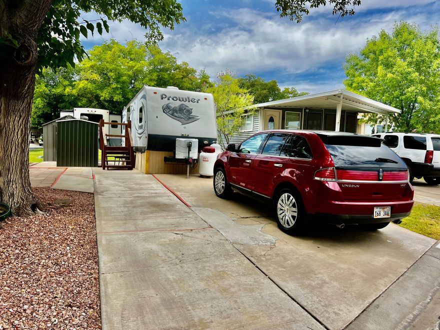 Nestled among the red mountains of Southern Utah, this shaded lot offers a peaceful setting within a desirable 55+ community. The property includes one large shed and is ideally located near shopping, golfing, medical facilities, and scenic walking paths-perfect for enjoying the best of Southern Utah living.