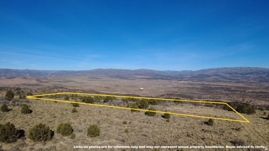 Take in sweeping, unobstructed views of the entire Fruitland Valley from this stunning 10 acre parcel.  One of the most scenic vantage points in the area.  Whether you're planning a quiet getaway, a hunting base or a future off-grid cabin, this land offers privacy, usability and a head start with a pre-leveled 90'x90' pad at the southeast corner for your RV or built site.  Access is easy with maintained roads leading most of the way in and the final stretch remains smooth and passable without deep ruts or large rocks. Unlike several surrounding areas, this parcel does not appear to have been impacted by the Dollar Ridge Fire, leaving natural vegetation and terrain intact.  The property is ideal for camping, recreation, or long-term development. Cell service is surprisingly reliable. While utilities are not yet stubbed, local contractors are readily available for well drilling, septic installation, and excavation, and many owners in this region successfully use modern off-grid solar systems as an alternative to bringing in power.  Located just minutes from Fruitland and close to Starvation Reservoir, Strawberry Reservoir, Current Creek, and endless trail networks, this land puts you in the heart of Utah's outdoor playground.  The views are even better in person-contact the listing agent directly for accurate directions and access details. All information is deemed reliable but not guaranteed; buyer to verify.