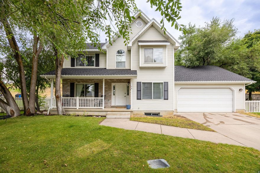 Welcome to 74 Canterbury Circle, a spacious and well-appointed two-story home in one of Logan's most desirable neighborhoods. Offering 2,781 finished sq ft, this home features 4 bedrooms and 4 bathrooms and a smart, inviting layout designed for everyday living and entertaining. Inside, you'll find warm tones and comfortable finishes, including a vaulted-ceiling master suite, cozy gas fireplace on the main floor, and newer appliances in the kitchen. A new roof and updated furnace bring peace of mind, while the finished basement provides added flexibility for a second family room, gym, theater, or guest suite. Outside, the .24-acre lot is shaded with mature trees, creating a private, peaceful setting perfect for relaxing or hosting in a quiet neighborhood. Located close to schools, parks, and shopping. Agent Owned.