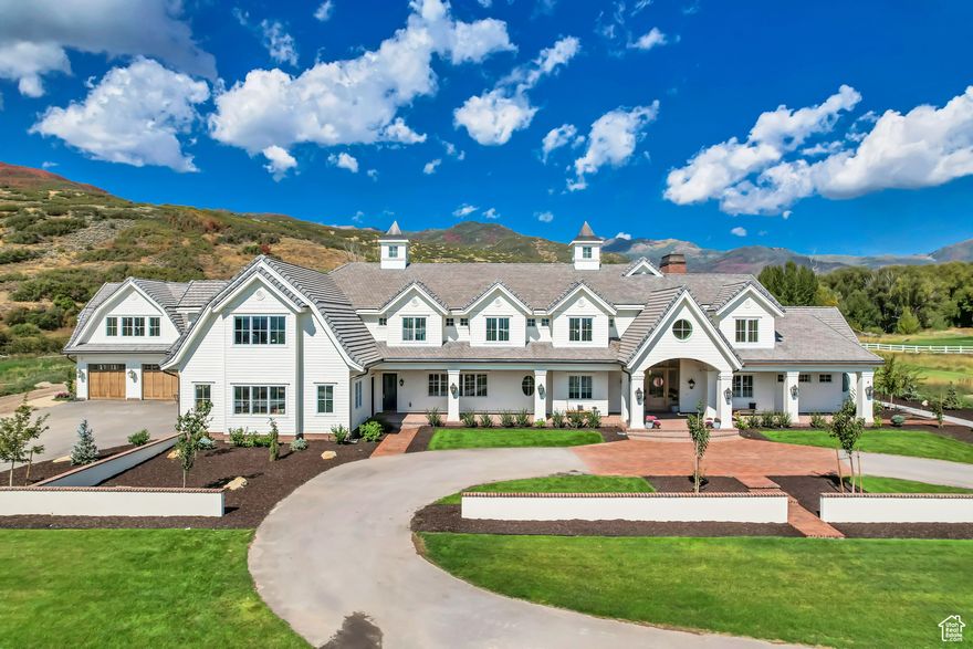 Experience country living at its finest in this stunning estate featuring just under 12,000 sq ft all above-grade, perfectly situated on 6 private acres in Midway's highly sought-after countryside with direct river frontage along Snake Creek. Just minutes from Midway's charming town center, world-class golf courses, ski resorts, and Deer Creek Reservoir, this home blends timeless charm with every modern luxury. Inside, you'll find vaulted ceilings, expansive windows that fill the home with natural light, a private office and den, and a gourmet kitchen complete with butler's pantry plus both formal and semi-formal dining spaces. Thoughtful conveniences include his-and-her closets with a stackable washer/dryer, 2 additional laundry rooms, and a 5-car +1 toy garage with space for all your hobbies. The home also features a 1-bedroom 1-bathroom attached casita/apartment with a separate kitchen & entrance. Entertainment and relaxation are built right in, with an in-home theater and wet bar, custom bunk room featuring 6 single beds and 2 double beds, resort-style pool and spa, pool house, and expansive yard that backs directly to Snake Creek, offering unmatched privacy. With gorgeous mountain views and a peaceful setting, this estate truly has it all. Welcome home to Midway. An additional ~3.7 acre parcel adjacent to the north along Snake Creek is also available for purchase.  Buyer/Buyer's Agent to verify all info.