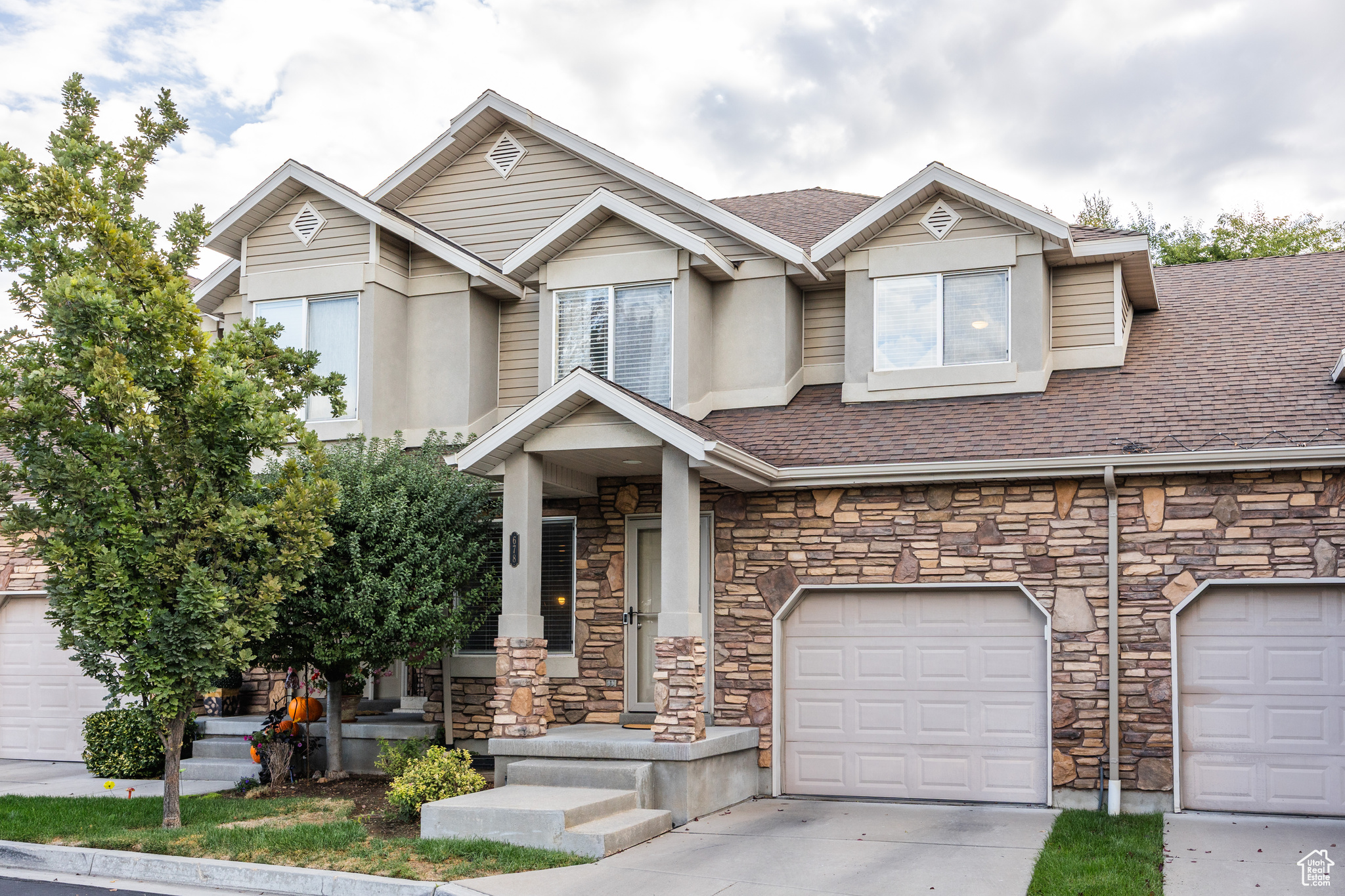This spacious, yet cozy townhome in the Layton/Kaysville area has been well-loved and perfectly maintained. Sitting on a quiet, dead-end street with a shared park area, you'll find yourself surrounded by green and peaceful spaces that make this neighborhood feel like a welcoming and well-kept secret. Inside this immaculate property, the kind of touches that create a warm and inviting home are evident throughout, from thoughtful paint choices to modern and clean design in the bathrooms. With more than 2,200 square feet of living space upstairs and down, there's room enough here to grow. The open kitchen and dining areas are bright with natural light, and a pair of glass doors walks out onto a balcony that offers idyllic, wooded surroundings-a small creek runs below, ducks wander, and mature trees offer privacy and shade (this, we think, would be a perfect spot for some al fresco dining). The water heater was replaced in 2021, and A/C followed in 2022, which provides peace of mind for the home's big systems. In terms of location, it feels tough to beat-residents here have easy access to the city and commuter routes, but there's a feeling of quiet seclusion that can't be beat.