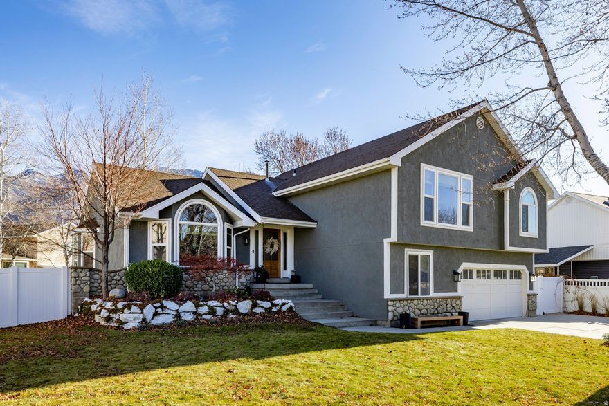 MULTIPLE OFFERS RECEIVED. HIGHESTAND BEST DUE AT 9:00 PM ON DECEMBER 17. PLEASE GIVE A RESPONSE TIME OF DECEMBER 18 AT 12:00 PM. Welcome to your dream home in the serene Hidden Valley area of Sandy! This beautifully remodeled residence is nestled on a quiet street, conveniently located close to loads of shopping and dining options, as well as the nearby canyons for outdoor adventures and skiing. Step inside to discover a newly remodeled, spacious kitchen that will captivate any chef. Featuring painted cabinets, luxurious quartz countertops, a stunning tile backsplash, and brand-new stainless steel appliances. This space is perfect for entertaining. The kitchen seamlessly flows into the elegant family room, highlighted by soaring double-high ceilings and a picturesque window with breathtaking mountain views. The spacious primary suite is designed for relaxation, complete with a large en-suite bathroom for your comfort. With four additional bedrooms, there's plenty of space for family, guests, or even a home office or workout room, accommodating all your needs. The home exudes a modern, updated feel with stylish shiplap painted accents, LVP flooring, and contemporary lighting throughout. Venture outside to the backyard oasis, an entertainer's paradise featuring a Trex deck that offers gorgeous mountain views and provides shade on warm summer evenings. The included trampoline and playset make this yard perfect for families and gatherings. Additional highlights include a walkout basement, recently replaced windows, and newer furnace and AC systems for added peace of mind. Don't miss the opportunity to make this stunning home yours!