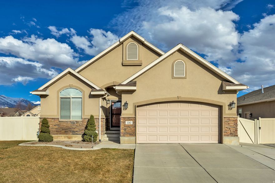***GRAND OPEN HOUSE SATURDAY, FEBRUARY 21ST 11AM - 1PM***Beautiful, well-maintained corner-lot home in desirable Lehi near Thanksgiving Point and the FrontRunner station. This 5-bedroom, 3-bath home offers 2,800 sq ft with an open-concept layout, vaulted ceilings, crown molding, and shiplap accents. The great room with gas fireplace flows into the kitchen featuring granite countertops, gas range, pantry, and large bar-perfect for entertaining. The primary suite includes a private bath with soaking tub and separate shower. Flooring includes engineered hardwood, slate tile, and carpet throughout. The finished basement offers two bedrooms, a  bath, storage room, and a family room with built-in speakers, bar area, and mini fridge. Enjoy the fully fenced backyard, overhead garage storage, and low HOA amenities including a clubhouse, pool, playground, and biking trails. Conveniently located near shopping, dining, and entertainment-this home offers space, comfort, and a prime location.   Buyer to verify all.