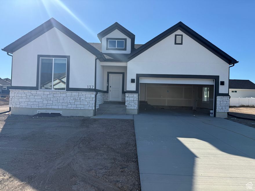 Move-in ready by mid-October! This beautiful Tremonton home is a rambler with an unfinished basement, featuring 3 bedrooms, 2 bathrooms, and a spacious open-concept design. The primary suite boasts a luxurious walk-in shower and generous closet space. You'll love the huge walk-in pantry, perfect for storage and organization, as well as the cozy fireplace in the main living area. The unfinished basement with 9' ceilings provides plenty of room to grow!  Don't miss your chance to own this stunning home-schedule your showing today!