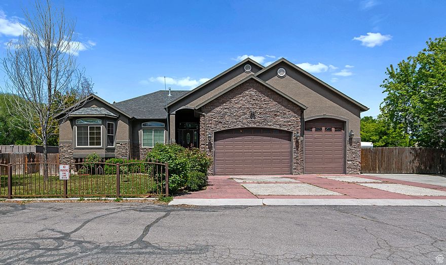 ***Home is located on a small private lane on the east side of 3200 W.  and is not rightr on 3200 W.***  Whether you are looking to suplement your mortgage payment by renting out the basment, or you love to entertain and need two kitchens, or maybe you are looking for a massive garage with ample RV Parking of 64 ft long by 24 ft wide, this home is for you. With a little elbow grease this home will sparkle like new. There is a functioning 3/4 bath at the end of 3rd car garage bay. ****This amount of space and features would cost you well over a millon dollars to build****