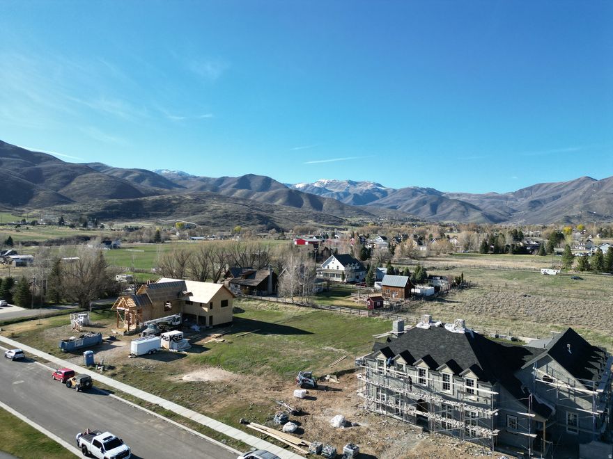 Discover a rare opportunity to build in the highly coveted Saddle Creek community in the heart of Midway, Utah.  This premium 0.54-acre south-facing homesite offers stunning views toward Deer Creek Reservoir and the iconic peaks of Mount Timpanogos. Ideally positioned across the street from a community greenbelt and walkway, the lot captures sweeping mountain and valley vistas while providing a serene and private setting.  Located in the prestigious Saddle Creek Ranch subdivision, this property represents a truly rare offering. All other lots in Saddle Creek are sold out, and the neighborhood is rapidly emerging as one of Midway's premier luxury communities, with multi-million-dollar custom homes currently under construction throughout the development. Opportunities to purchase land here seldom come to market.  Midway offers exceptional year-round recreation and lifestyle amenities. Enjoy world-class skiing in nearby Park City and Deer Valley Resorts, boating and water recreation on Jordanelle Reservoir and Deer Creek Reservoir, and charming local dining throughout Midway. Outdoor enthusiasts will appreciate close proximity to Soldier Hollow for golf, nordic skiing, mountain biking, and expansive trail systems, along with quick access to the scenic beauty of Provo Canyon.  Surrounded by the charm of Midway and the natural beauty of Heber Valley, this homesite offers an exceptional blend of privacy, luxury, and adventure.  Build your dream home in one of Midway's most exclusive neighborhoods, where views, location, and opportunity rarely align.