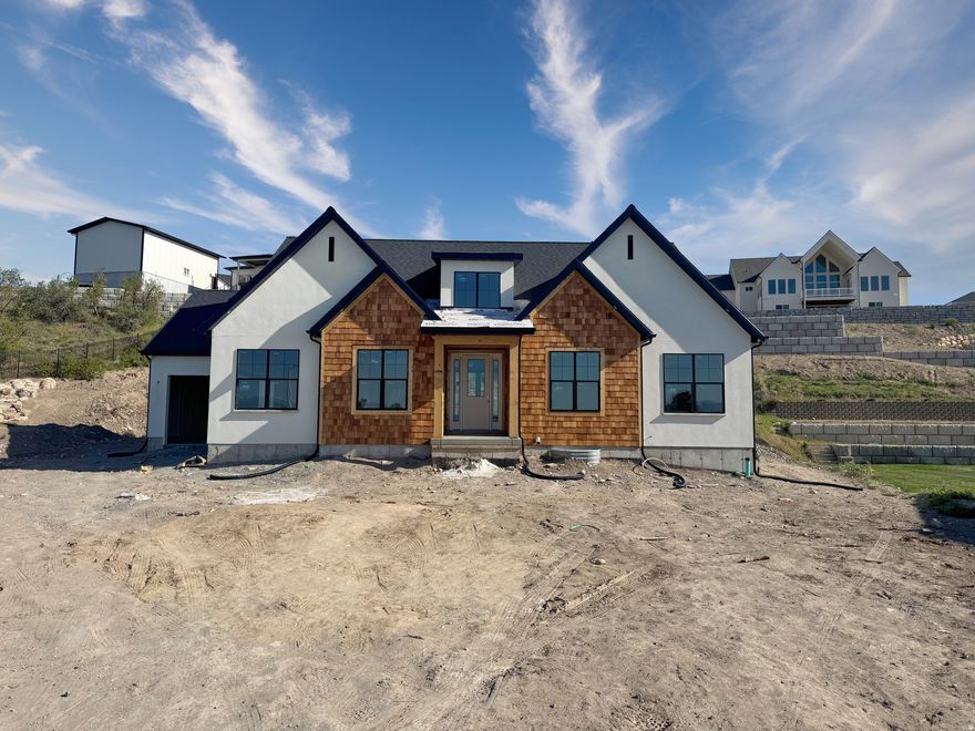 ** OPEN HOUSE SATURDAY MAY 9 FROM 3PM-5PM, COME CHECK IN AT 1872 S 100 E Payson FIRST** 3.99% 5 year ARM, or 4.99% Fixed interest rate, or $20,000 toward closing costs when using our preferred lender! (terms and restrictions apply).  Final opportunity in Payson View Estates! This stunning 5,429 SF Elizabeth sits on a .53 acre lot and  is the last available home in the subdivision. Offering high-end finishes, main level primary suite, massive garage, future ADU potential, and an unbeatable location in a quiet cul-de-sac at the base of Payson Canyon. The home features 4 bedrooms, 3.5 bathrooms, vaulted ceilings, and beautifully custom-designed cabinetry and bathrooms throughout. The oversized deep 3rd car garage provides excellent space for larger vehicles, and storage.  With a partially finished basement that includes 2 bedrooms and a full bathroom, while the remaining unfinished space is thoughtfully laid out with the potential to create a separate 2-bedroom ADU.  This home is scheduled to be complete mid June 2026. Hurry before it's gone! PLEASE BE CAREFUL WHEN VIEWING, HOME IS UNDER CONSTRUCTION.