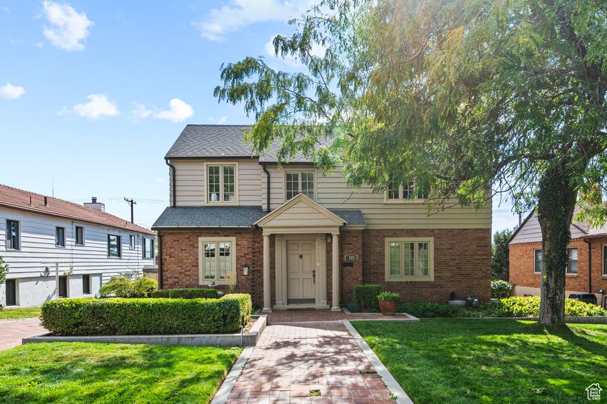 This remarkable two-story home is nestled in the prestigious upper avenues, offering both exceptional design and an enviable location. Formerly owned by a renowned artist and architect, the property showcases thoughtful features and timeless architectural details that set it apart. The inviting floor plan flows seamlessly, creating an ideal space for both relaxing and entertaining. Step out from the formal dining room to a lovely outdoor patio, perfect for gatherings or quiet moments. The deep backyard is beautifully landscaped, providing a peaceful retreat and impressive outdoor living space.