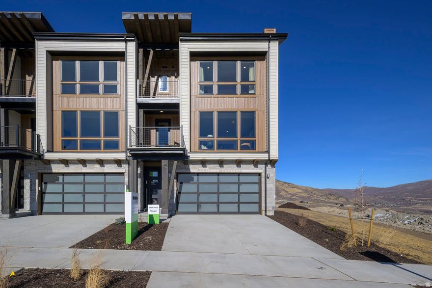 Experience life elevated at The Pointe at Current-a community where modern design meets mountain tranquility. Perfectly positioned between Park City and Heber City, this contemporary townhome captures the best of Utah's outdoor lifestyle. Overlooking the scenic western edge of Jordanelle Reservoir, it offers easy access to endless recreation-from lakeside adventures to world-class skiing and miles of hiking and biking trails. A private underpass beneath SR-450 provides quick and convenient entry to Deer Valley Resort, so you're always minutes from your next mountain escape.  Built to Garbett Homes' Efficiency+ standards, this home is thoughtfully engineered for comfort, sustainability, and savings. Advanced insulation, Solar-E windows, and an innovative air-recirculation system work together to enhance natural light, improve indoor air quality, and maintain year-round energy efficiency.  Step inside to discover a bright, open interior with sleek modern finishes-including quartz countertops, custom cabinetry, and durable, high-performance flooring. Enjoy the peaceful mountain views from your private balcony, or retreat upstairs to one of two spacious primary suites. The grand suite features its own private deck-perfect for morning coffee or sunset views over the peaks.  With no HOA restrictions on nightly rentals, this home offers remarkable flexibility-ideal as a full-time residence, vacation getaway, or investment property. Buyers will also enjoy a limited-time opportunity to personalize all design center selections.  Estimated completion: JulyAugust 2026. Ask about current buyer incentives available through our preferred lender!