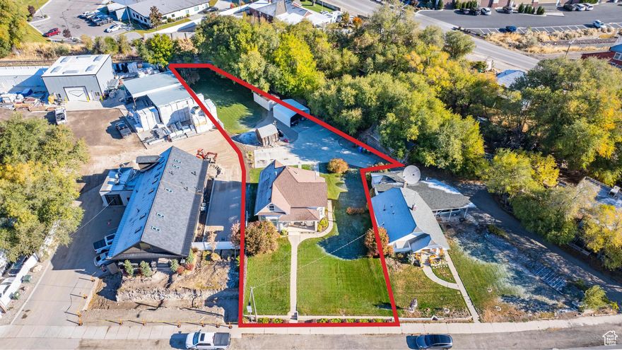 Don't miss this unique property!  The sky is the limit for the potential uses of this parcel.  Located in the center of Lehi, this would be a great boutique, rental, office space of future multi-family apartment complex.  Use your creativity and make a fantastic investment!