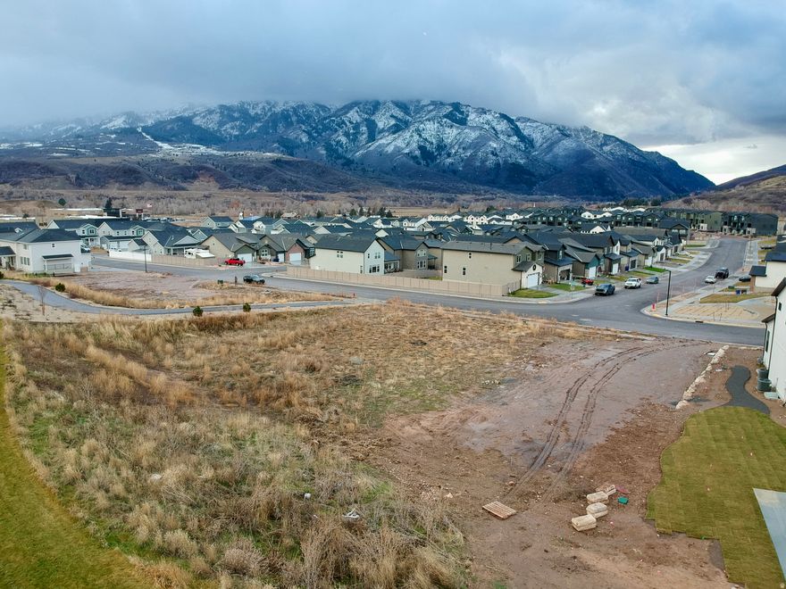 Build your dream mountain retreat on this rare 0.33-acre homesite - the final available lot in the highly sought-after ROAM community. Framed by sweeping mountain views, this mostly level, easytobuild lot with utilities stubbed to the property line is an ideal canvas for your custom home.  Zoned for nightly rentals (Airbnb/shortterm stays), this property offers compelling income potential. Design a home with a basement suite to help offset ownership costs, or simply create a private getaway you can share with guests when you're not here. Owners and visitors alike will love being right across the street from the neighborhood playground and just a short walk from the pickleball court.  From your front door, you're only about 15 minutes from worldclass skiing at Snowbasin, summer days on Pineview Reservoir, and miles of hiking and mountain biking trails in every direction. Opportunities like this in ROAM are nearly gone-secure this homesite now and start designing the mountain lifestyle you've been dreaming of.