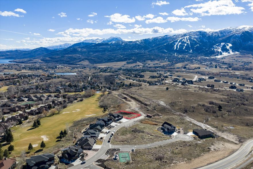 Discover an extraordinary opportunity to build your dream mountain retreat in the heart of Eden within the prestigious Eden Escapes community. This premier building lot offers luxury living, investment potential, and an unbeatable golf course setting-all in one of Northern Utah's most desirable destinations.  Perfectly positioned backing directly to the 15th hole of Wolf Creek Golf Course, this homesite captures serene fairway views and Wasatch Mountain views, the best of both worlds.  This lot requires construction with the community's exclusive custom builder, Watts Enterprises, known for exceptional craftsmanship and high-end finishes. Buyers have the unique advantage of fully customizing their luxury single-family home to suit their lifestyle-whether you envision a modern mountain masterpiece, a warm alpine retreat, or a high-performing nightly rental property.  Eden Escapes allows nightly rentals, (3 night minimum), making this an ideal opportunity for a primary residence, second home, or income-generating investment. With close proximity to world-class skiing at Powder Mountain and Snowbasin, along with boating at Pineview Reservoir, outdoor recreation is just minutes away in every season.  Uniquely, this lot has already paid the Wolf Creek Water & Sewer connection fees, saving you up to $40,000.   Build your custom dream home, enjoy golf course frontage, and take advantage of nightly rental flexibility-all in one remarkable Eden Escapes homesite. This is mountain luxury living at its finest.  Square footage figures are provided as a courtesy estimate only and were obtained from county records.  Buyer is advised to obtain an independent measurement. All information herein is deemed reliable but is not guaranteed. Buyer is responsible to verify all listing information, including square feet/acreage, to buyer's own satisfaction.