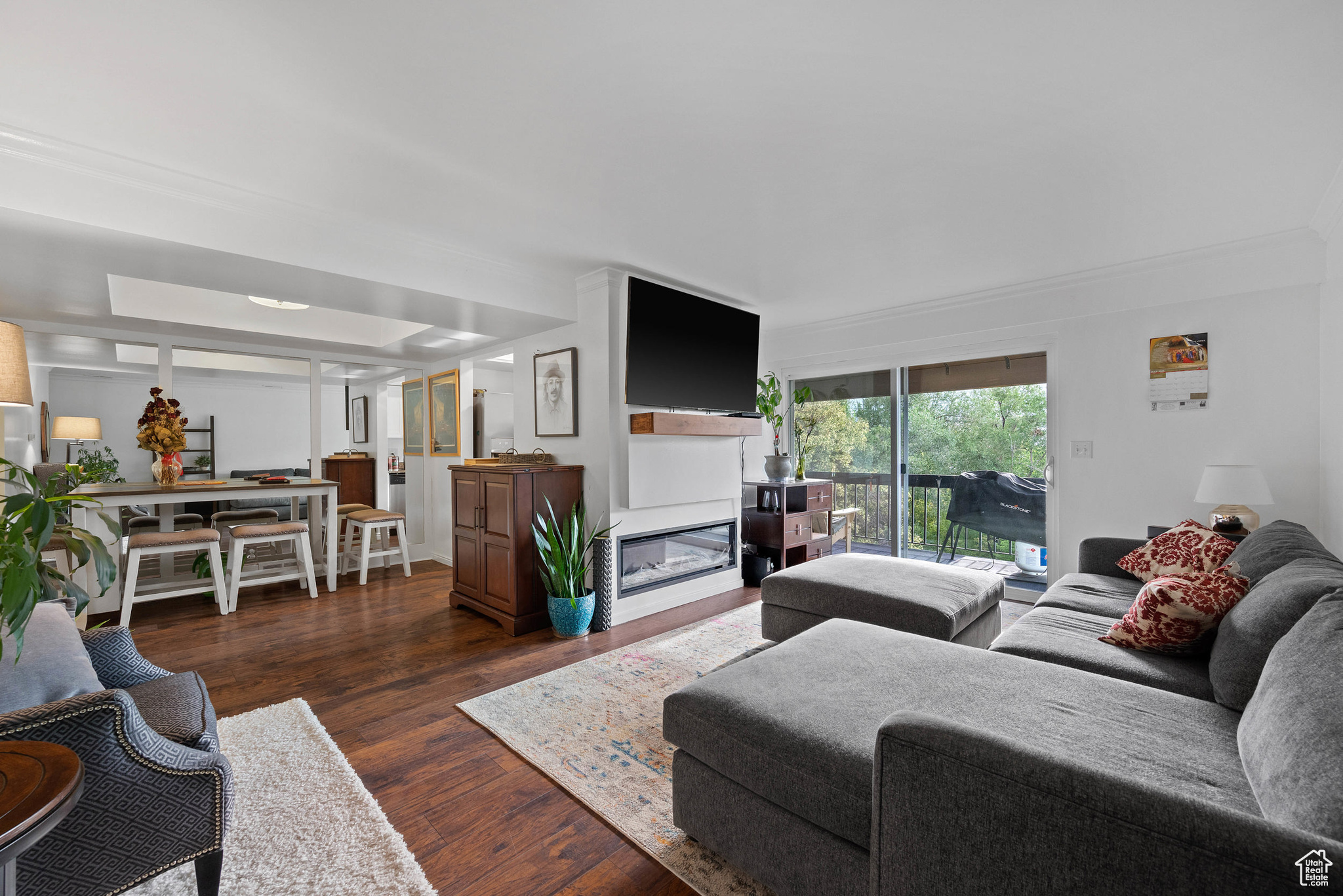 This top-level corner unit offers one of the best locations in the community with unobstructed views of the Wasatch Front and expansive open space right outside your windows. Enjoy the privacy that comes with being in a top-floor, end-unit setting. Inside, the condo has been updated and carefully maintained. The kitchen features updated appliances, modern finishes, and plenty of storage. Upgrades throughout the home provide both style and function. The community is well cared for and includes amenities such as a beautiful pool, which is perfect for relaxing during the warmer months. Additional conveniences include two covered parking stalls, offering protection and ease of access year-round. With its combination of location, views, condition, and amenities, this condo is truly move-in ready and an excellent opportunity for buyers seeking comfort and convenience.