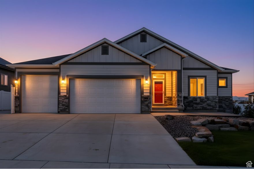 Discover this stunning 5-bedroom, 3-bathroom home in Herriman, featuring soaring 9' ceilings and a vaulted oversized great room that spans both levels. The spacious layout includes a large deck accessible from the master suite and great room with a 12 foot Slider, perfect for outdoor entertaining. The walkout basement offers a separate entrance, framing, and roughed-in plumbing for a future kitchen and laundry, with two rooms ready for texture and carpet-ideal for a rental or guest suite. Enjoy panoramic valley and mountain views from the deck and large patio beneath. The south-facing home reduces snow removal and includes an RV pad, a three-car garage with an extra-long third bay, upgraded knotty alder cabinets, porcelain tile in common areas, and an EPA-approved wood stove for red days. Central A/C, fully fenced yard with gates, and a spacious basement make this a versatile, move-in-ready property.
