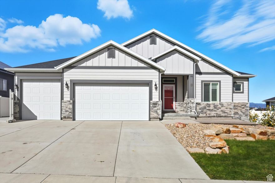 Discover this stunning 5-bedroom, 3-bathroom home in Herriman, featuring soaring 9' ceilings and a vaulted oversized great room that spans both levels. The spacious layout includes a large deck accessible from the master suite and great room with a 12 foot Slider, perfect for outdoor entertaining. The walkout basement offers a separate entrance, framing, and roughed-in plumbing for a future kitchen and laundry, with two rooms ready for texture and carpet-ideal for a rental or guest suite. Enjoy panoramic valley and mountain views from the deck and large patio beneath. The south-facing home reduces snow removal and includes an RV pad, a three-car garage with an extra-long third bay, upgraded knotty alder cabinets, porcelain tile in common areas, and an EPA-approved wood stove for red days. Central A/C, fully fenced yard with gates, and a spacious basement make this a versatile, move-in-ready property.