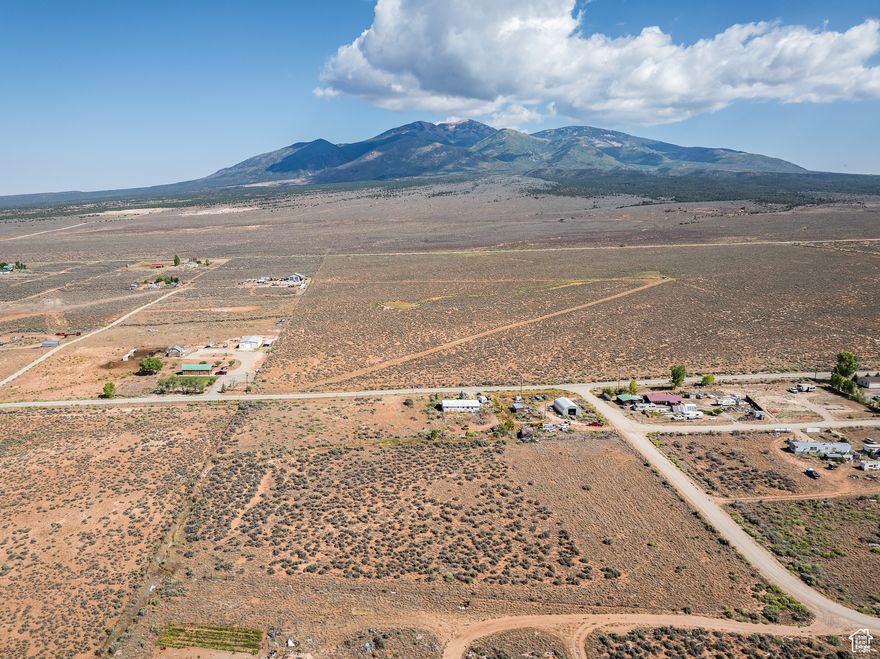 Crested wheatgrass and sagebrush fill this fully fenced 3.78 parcel. Bring your animals and set-up a ranchette just thirty minutes from Moab. Enjoy cooler temps in the summer with views of the La Sal Mountains.  An irrigation ditch runs along the property, and the seller is willing to sell up to two shares of the coveted La Sal Irrigation water rights with the purchase of this property. This will be separate from the property sale.  Please note these shares are only available for purchase with the sale of this parcel. There is also a water right from the State of Utah for this property so you will be one step closer to getting a well.