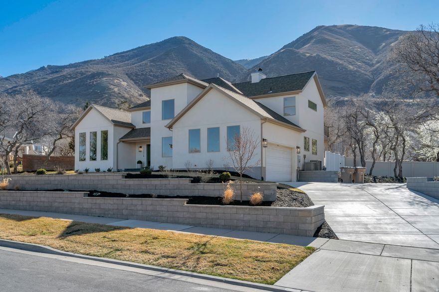 Stunning fully remodeled Draper Oaks home for sale in Draper Utah  this 6-bedroom gem boasts high-end finishes throughout after a complete transformation that was permitted and inspected by Draper City and completed by a licensed GC. A perfect place to entertain friends and gather with family, this move-in-ready residence sits on a spacious 0.40-acre lot in the desirable Draper Oaks neighborhood, featuring beautiful homes, mature trees, and a perfect blend of brand-new and established landscaping. Enjoy breathtaking mountain views from the back patio and primary suite deck, plus sweeping valley views from the front rooms and porch. Nestled in highly regarded Draper with top-rated Canyons School District schools, you're just minutes from Corner Canyon's extensive hiking and biking trails-ideal for year-round outdoor adventures in Draper Utah-and easy freeway access to the Salt Lake tech center and Silicon Slopes job hubs. Gather and cook in the open-concept gourmet kitchen featuring brand-new Thermador appliances, quartzite countertops, a large island, butler's pantry with a full-size side by side fridge and freezer, and new hardwood floors. Retreat to your peaceful primary suite with walk-in closet, soaking tub, and separate shower. Downstairs, the large family room with wet bar and daylight basement offers tons of space for game nights, movies, snacks, and family fun-perfect for relaxed living in this 5,315 sq ft layout. New plumbing, electrical, high-efficiency HVAC, wood floors throughout, new roof, windows and doors, and new fresh exterior make this luxury-level home feel completely brand new with RV parking included, and as a bonus, no HOA. If you are looking for a turnkey, remodeled home near Corner Canyon in one of Draper's most desirable pockets, this is the opportunity you've been searching for-don't miss out on this Draper Oaks real estate gem. Square footage figures are provided as a courtesy estimate, buyer is advised to obtain an independent measurement.