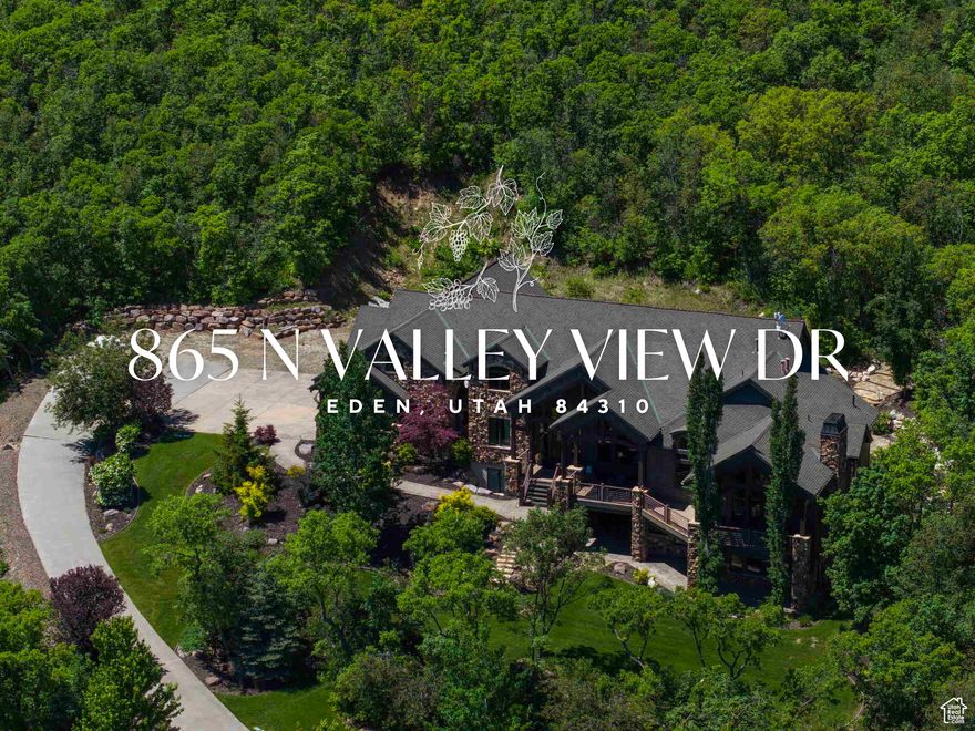 Best Views in Ogden Valley! Set amidst the picturesque Eden foothills and commanding a lofty position above Pineview Reservoir, this extraordinary marvel seamlessly marries the majesty of the mountains with the tranquility of the lake. Prepare to be captivated by this extraordinary mountain estate, ensconced among the trees, offering unparalleled privacy and awe-inspiring lake views. As you approach, meandering through the mature trees beneath rustic timber trusses, you'll be drawn onto the expansive wrap-around deck, a gateway to this inviting and cozy sanctuary. This spacious haven boasts seven bedrooms, including five with ensuite bathrooms. The great room, a focal point of the home, showcases panoramic picture windows that frame the picturesque lake and valley below. Its vaulted ceilings, suspended by substantial timber trusses, are a testament to the meticulous craftsmanship embodied in this residence. Freshly painted and carpeted, the house offers radiant heat throughout, ensuring a warm welcome on even the coldest winter days. The well-designed kitchen, featuring an expansive island, provides ample space for both entertaining and dining. Descending to the lower level, you'll be greeted by 10-foot ceilings and abundant natural light streaming in through large picture windows, illuminating the home. French doors offer convenient access to the front yard. Upstairs, a loft and built-in library await your discovery. Outdoor living harmoniously flows from the main living area to the covered back patio and firepit, effortlessly connecting you to the natural beauty of Eden. Surrounded by open space on two sides, the tranquility is yours to savor, far from the hustle and bustle of neighbors. Notably, this luxury home is free from the constraints of any HOA. This residence is thoughtfully designed for those with diverse interests, offering spaces for entertainment, including a tiered theater room, a home gym, an indoor sports area spacious enough for a trampoline, an office, a whimsical kids' castle tucked under the stairs, and a generous craft room primed for creativity. For the avid collector or enthusiast, the generously-sized four-car garage boasts a new epoxy floor and electric vehicle charging stations. Additionally, the lot accommodates the potential construction of an extra shop or garage, should your storage needs expand. Winters here are made hassle-free by a 300-foot-long driveway and sidewalks equipped with an automated radiant heating system, ensuring easy access to those coveted first tracks on a powder day. Conveniently situated just minutes from the Yacht Club and public boat ramp, this home allows you to gaze upon the Reservoir from the master bedroom window-an exclusive feature that sets it apart from all others in Utah. This is a remarkable offering catering to individuals who appreciate the finer things in life. While home automation and lighting control are seamlessly integrated, it's worth highlighting the convenience of effortlessly turning off every light as you step out the door. Access to Snowbasin, only a 15-minute drive away, is a winter enthusiast's dream. This location is among the best in Ogden Valley, with quick access to Pineview Reservoir, three ski resorts, and an abundance of biking and hiking trails. Your year-round adventure begins here. Please note that furnishings are not included. *Wireless Broadband is 1 GBT *All property information, boundaries and documents to be verified by buyer.