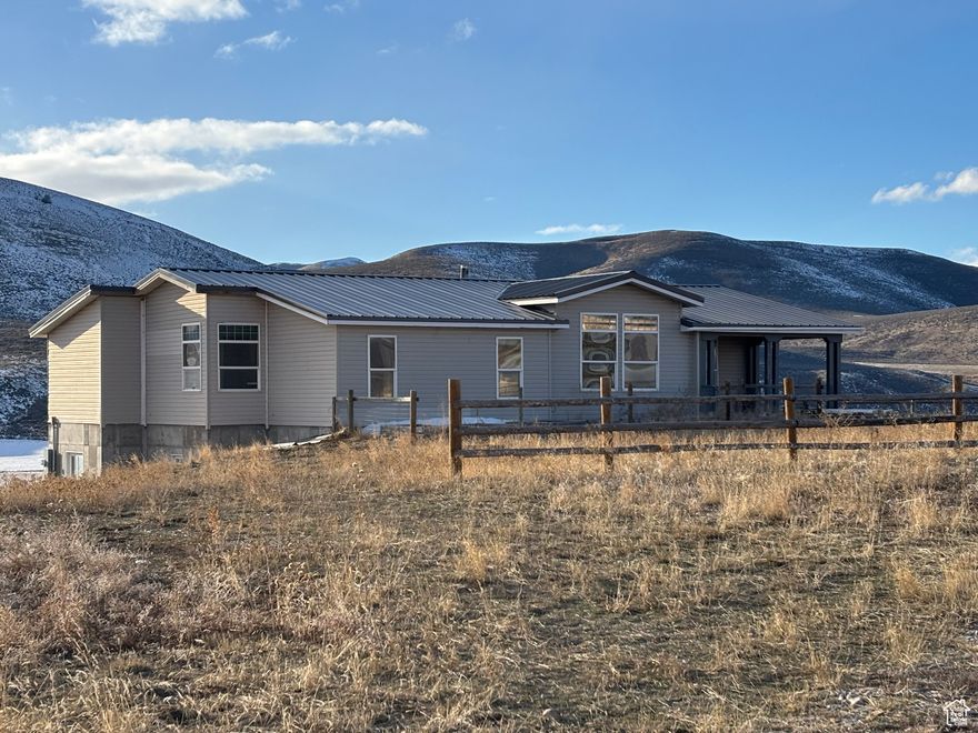 Beautiful hilltop location overlooking the Malad Valley. This home has 3 bedrooms and 2 baths with a large living room with wood stove and an open kitchen with plenty of windows to enjoy the sunlight. There is new flooring in the upstairs and a spiral stair case to the partially finished basement with plumbing for a bath, bedrooms and large family room area. There are also French doors for a walk out basement entrance. The property consists of approximately 111.69 acres of farm ground with about 80 acres planted in dryland mix pasture grass and the remaining acreage in pasture. There is a hydrant by the corrals providing water for livestock and a shed with a chicken coop. This is set up and ready for country living! Come take a look at the amazing views in every direction. This property has numerous possibilities and additional land available.