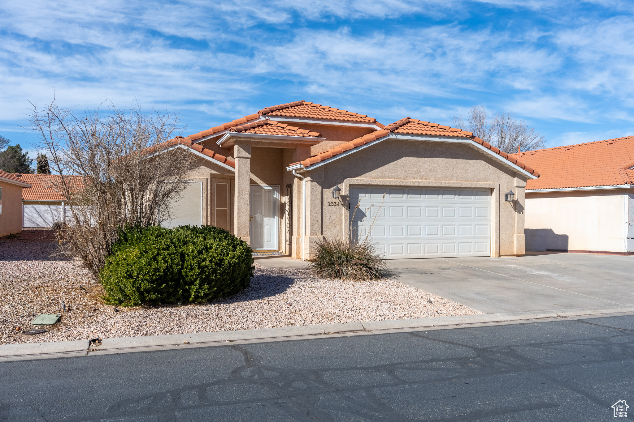 The cute 3-bedroom, 2-bathroom home in Shadow Canyon is now available! Home is currently tenant occupied and would make for a great investor opportunity. (Lease till September). Enjoy the fully fenced and private backyard with a spacious covered patio. Conveniently located near trails, schools, shopping, Zions National Park, and Sand Hollow Reservoir, this home offers a great location to nearby amenities. Summer days become unforgettable with access to the indoor swimming pool and clubhouse included in the low HOA fees. Additionally, the 2-car attached garage features built-in shelving for extra storage, while the extra-large parking pad on the side provides extra room for recreational vehicles or additional parking needs.