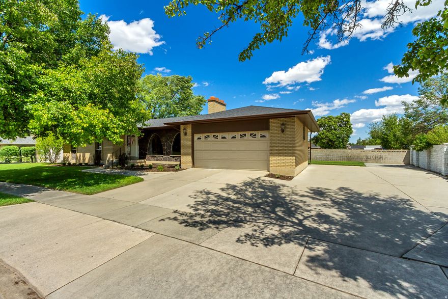 Welcome home to one of the best locations in the neighborhood! Tucked away on the very last street, this home offers peace, privacy, and minimal traffic in an established community lined with mature trees. Situated on a spacious .29-acre corner lot, there's plenty of room to enjoy the outdoors, entertain, play, or park your trailer, boat, or toys with the oversized side driveway.  Inside, the home is filled with natural light thanks to large windows throughout and features thoughtful updates that make it both stylish and functional. The fully updated kitchen includes granite countertops, updated flooring, a pantry, and a gas range perfect for cooking and gathering. The inviting layout offers great flow for everyday living with multiple gathering spaces and two cozy fireplaces.  The spacious primary suite is conveniently located on the main level and easily accommodates a king-size bed, creating a comfortable private retreat. The updated primary shower adds a fresh, modern feel to the space. Upstairs, you'll find two additional bedrooms, while the downstairs offers a guest room and dedicated office space, giving flexibility for visitors, working from home, hobbies, or a growing household.  With updated features, beautiful natural light, established trees, and space to grow both inside and out, this home combines comfort, functionality, and charm in a truly hard-to-beat location.   And say goodbye to long commutes and enjoy the perfect balance of convenience and comfort. Located just 6 minutes from the freeway, less than 20 minutes from downtown Salt Lake City, and only 15 minutes from the airport, this home makes getting anywhere in the valley quick and easy while still offering the peace and quiet of an established neighborhood.  Roof about 3.5 years old.