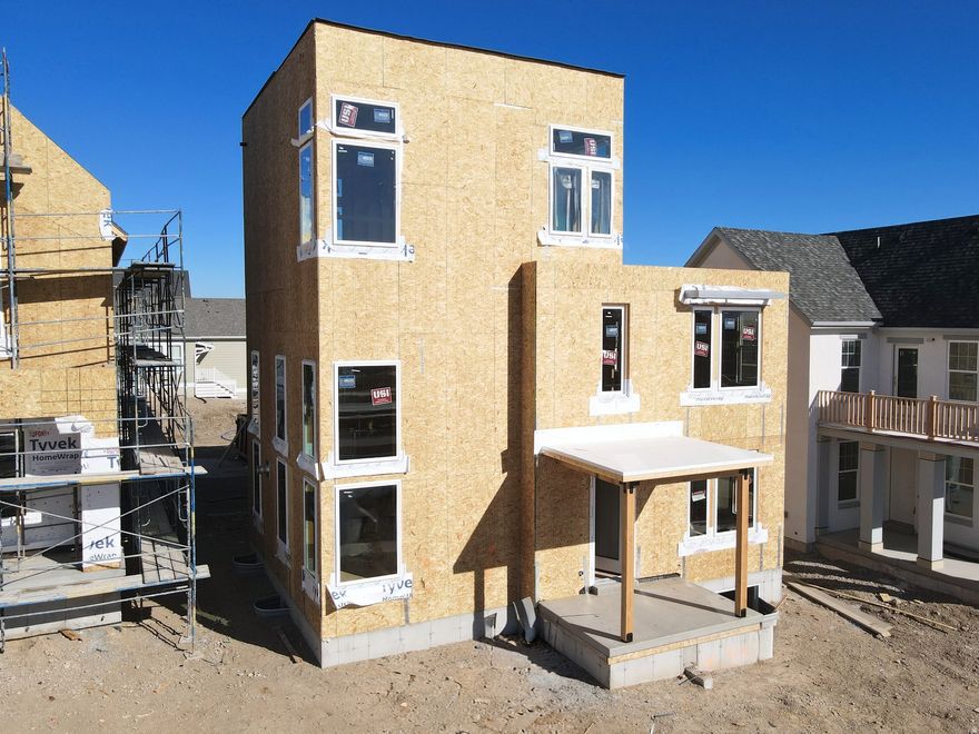 Show-stopping Innovator Sky plan currently under construction! This home features a third-level Sky Room with a wet bar, offering stunning views overlooking the Watercourse, along with east-facing views from the hot-tub-ready Sky Deck, perfect for entertaining. Thoughtful upgrades throughout include a finished basement, quartz countertops, gas range, upgraded cabinetry, hard-surface flooring, modern railing, a gas fireplace, and more. The open floor plan offers a spacious great room that flows seamlessly into the dining area and kitchen, plus a convenient main-level office. Located in the desirable Watermark Village at Daybreak with easy access to the watercourse and a wide array of community amenities. Estimated Summer 2026 completion *Interior finished photos are of a previously built home of the same floor plan for example purposes. Upgrades and finishes will vary*