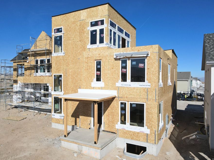 Show-stopping Innovator Sky plan currently under construction! This home features a third-level Sky Room with a wet bar, offering stunning views overlooking the Watercourse, along with east-facing views from the hot-tub-ready Sky Deck, perfect for entertaining. Thoughtful upgrades throughout include a finished basement, quartz countertops, gas range, upgraded cabinetry, hard-surface flooring, modern railing, a gas fireplace, and more. The open floor plan offers a spacious great room that flows seamlessly into the dining area and kitchen, plus a convenient main-level office. Located in the desirable Watermark Village at Daybreak with easy access to the watercourse and a wide array of community amenities. Estimated Summer 2026 completion *Interior finished photos are of a previously built home of the same floor plan for example purposes. Upgrades and finishes will vary*