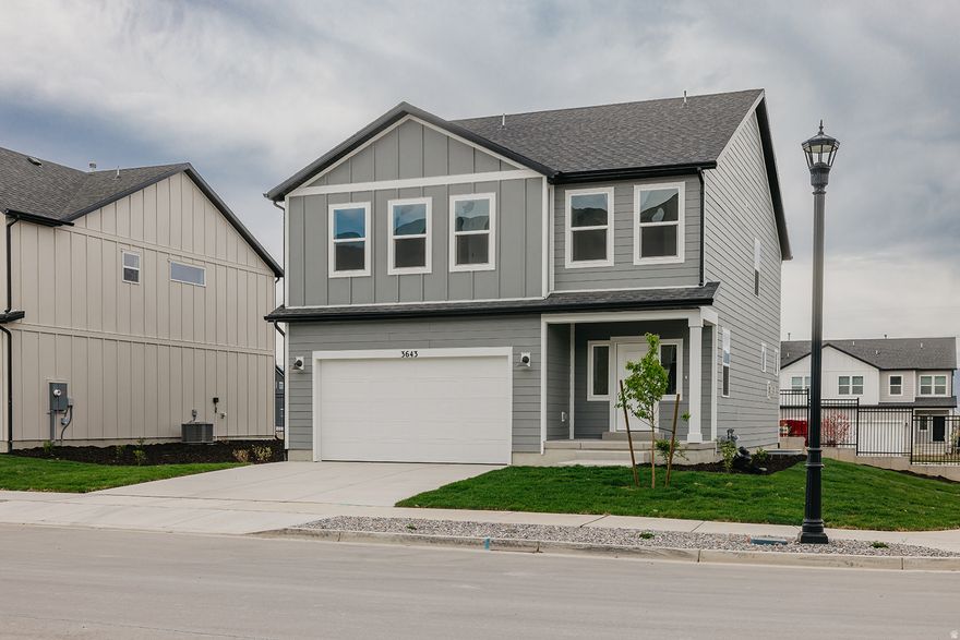 Move-in ready Sweetwater featuring 3 bedrooms and 2.5 baths with a layout designed to impress. The family room showcases soaring 20-foot open-to-below ceilings and a cozy fireplace, creating a bright and dramatic gathering space. The main level also offers 9' ceilings and seamless flow into the kitchen, complete with white upper cabinetry and a large island perfect for entertaining and everyday living. Upstairs, the owner's suite provides a relaxing retreat with a spacious walk-in shower. Ask about available seller incentives when financing with our Preferred Lender! Home will be completed end of March.