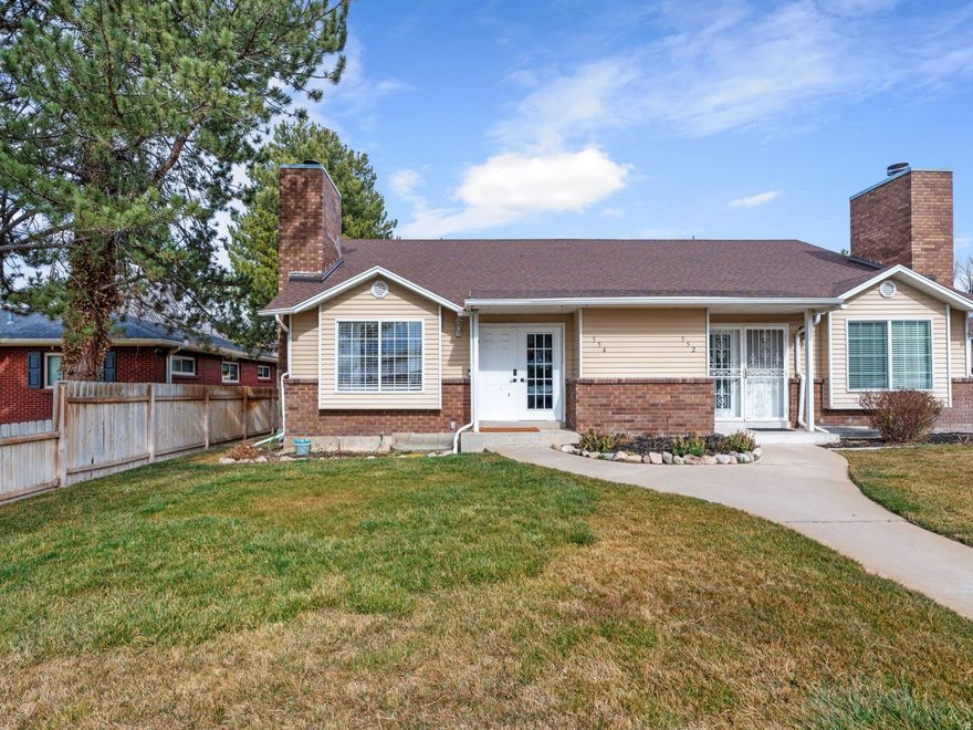 Completely remodeled in 2024, this 3-bedroom, 2.5-bath condo offers convenient access to I-15 while remaining tucked away for added privacy.  The renovation includes brand-new flooring, fresh paint, and fully updated kitchen and bathrooms. The kitchen features quartz countertops and dark cabinetry, offering a warm contrast to the typical gray palette. An added built-in bar provides additional space for entertaining.  The primary suite includes an en suite bathroom with double sinks and a dedicated laundry area. A second laundry space adds flexibility. The gas fireplace anchors the main living area.  Parking includes a 1-car garage and a covered carport.  Buyer to verify all square footage.