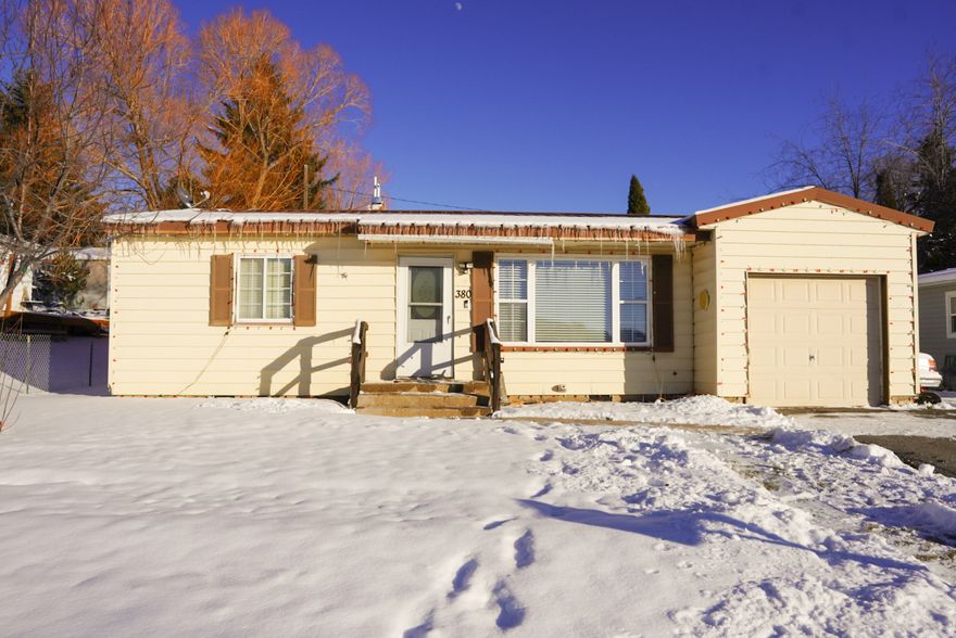 Beautiful 2-bedroom, 1-bath home on .3 acre. This home showcases a clean, white, contemporary interior with modern finishes throughout. The kitchen features oak cabinets, complemented by new flooring in all rooms (except the laundry room), updated trim, and stylish new fixtures. Additional highlights include a large laundry room, a 1-car attached garage, and a spacious yard fully enclosed with a 6 ft fence, offering privacy and plenty of usable outdoor space. This home is conveniently located close to popular walking trails and local amenities. Thoughtfully finished and well maintained, this home is truly move-in ready. Come see today!