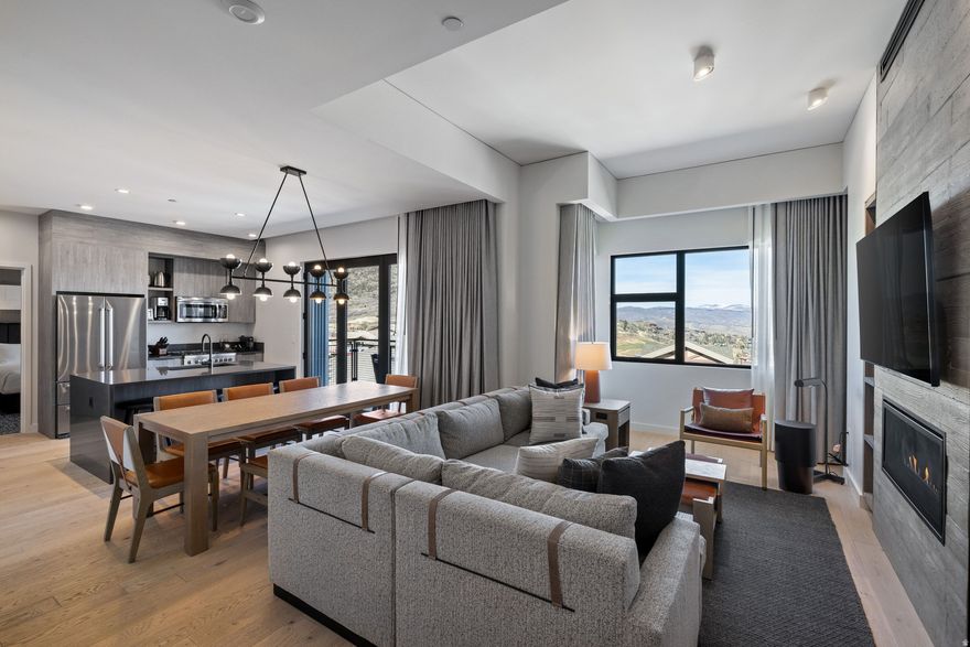 Experience ski-in/ski-out living from the top-floor penthouse, ideally located in the Pool Building of the Pendry Residences at Canyons Village. This fully furnished and turnkey residence offers a rare single-level layout with two true primary suites, plus a bunk room. Expansive views overlook Canyons Village, providing a front-row seat to seasonal fireworks and drone shows, best enjoyed from your private exterior patio. Inside, the residence is thoughtfully equipped with high-end finishes, a full kitchen, and seamless indoor-outdoor flow for easy entertaining or relaxing aprs-ski. Just steps from the Sunrise Gondola, this location delivers immediate access to world-class skiing, hiking, and mountain biking. Ownership includes dedicated ski storage through Compass Sports for a streamlined on-mountain experience. As part of the Pendry, residents enjoy a full suite of luxury amenities including a pool, spa, fitness center, rooftop pool and bar, and in-room dining. Ownership also includes access to Pendry/Montage hotel benefits and discounts, elevating both personal use and rental potential. A coveted opportunity to own a top-floor penthouse in one of Park City's most amenity-rich and centrally located communities.