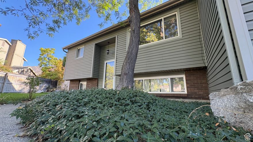 Current appraisal at $685,000! This unique split-entry home blends comfort and character with fresh interior paint, new LVP flooring, updated lighting, and a darling kitchen with freshly painted cabinets and newer appliances. Enjoy three inviting living areas, including a big, fun family room with lofty ceilings and a cozy fireplace, plus a bright daylight basement with space to add an extra bedroom or office. Recent upgrades include a newer roof, furnace, added insulation, and central air-so you can relax year-round. Outside, you'll love the automatic sprinklers, generous garden space, secluded backyard, and two-car garage. Tucked away on a quiet cul-de-sac near schools and just one mile from Big Cottonwood Canyon and world-class ski resorts, this home is clean, cheerful, and move-in ready.