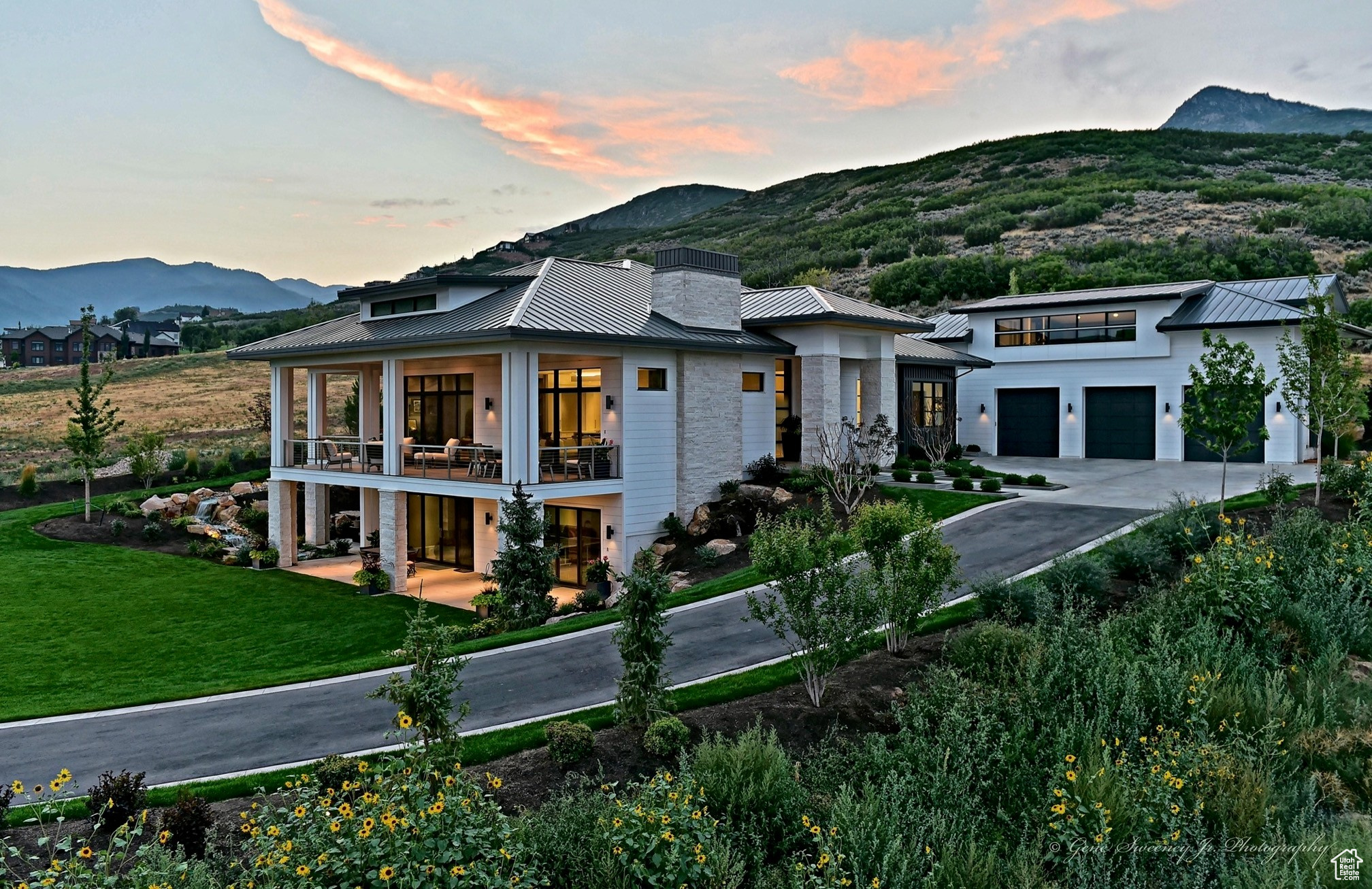 This magnificent residence is perfectly nestled in the northern foothills of the Midway valley and allows convenient access to year-round adventures in the 10,000 acre Wasatch State Park, which boasts 30 miles of hiking, biking and nature trails in which to relish. The home is thoughtfully situated to maximize stunning views of the Heber Valley, surrounding views of Snake Creek and Huber Peak to the North. This majestic property provides a backdrop of mature landscaping enveloping a private fire pit, a zip-line, in-ground trampoline and a robust water feature that brings the tranquil sounds of a mountain stream to be enjoyed on the expansive decks, interior gathering spaces, lower level suite and the grand Owner's Suite. This exquisitely crafted Prairie designed home fits seamlessly into the rural Midway surroundings while offering everything that could be desired in the timelessly appointed interior space. From being bathed in natural light upon entry and throughout this open concept plan, to a breathtaking Kitchen with Thermador appliances, a Grand Pantry and Butler's Pantry, 5 generously sized bedrooms all with ensuite baths, 2 powder baths, an exciting kids' hangout, lower and upper level gathering spaces, video room and hidden playroom, this home has plenty of space to relax and unwind or host gatherings filled with family and friends. This home truly has it all! Some notable architectural elements that adorn the home include 10' tall window and glass openings, double quad sliders leading to the spacious deck and lower patio, 12' ceilings with LED floating coffers and lighted coves. Sophisticated cabinetry, fireplace detailing and expertly designed interior elements become the focal point of each meticulously detailed space. Other notable highlights include an oversized 3-car garage with interior workshop, whole house fan, 1,000 gallon water storage tank, automated lighting and motorized rollershades. Don't miss your chance to own this one-of-a-kind dream home and experience the best of mountain living.