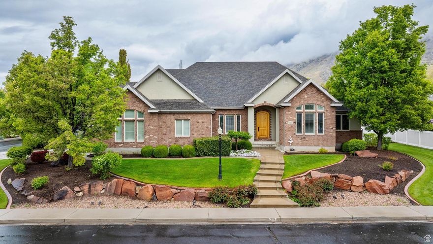 **OPEN HOUSE SATURDAY 6/14 10AM-12PM** $100,000 price drop! Seller says sell it now! Rare, all brick, 6,400 sqft all brick rambler perched on the prestigious east bench of Lindon, sitting on nearly half an acre of fully fenced, beautifully landscaped land.  From the moment you step inside, you'll feel it: this home means business. Towering ceilings. An absolutely stunning custom kitchen loaded with high-end appliances. The kind of craftsmanship, layout, and finishes you'd expect in a $1.5M+ home-because it is.  The fully finished basement gives you all the space you need (and then some). The massive 1,100 sqft garage is oversized and ready for your truck, toys, tools, or even a workshop. Got an RV? No problem-there's tons of parking.  This home has been meticulously maintained and is completely move-in ready. All that's left is for you to see it in person.   .48 acre lot  6,400 sqft of perfection  Oversized garage + RV parking  Beautiful yard + mountain views  Come see what makes this home unforgettable.