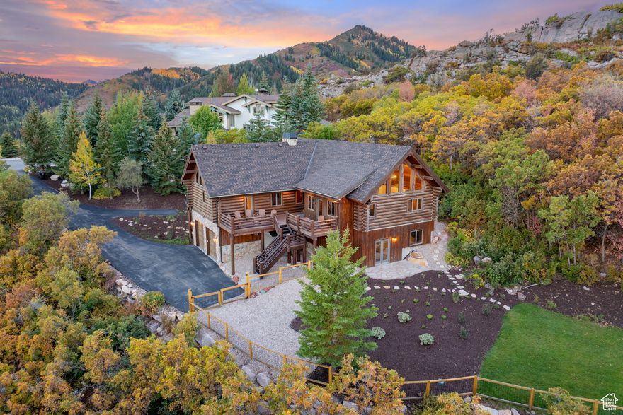 Escape to this Alps-inspired mountain chalet at the top of Pinebrook with unparalleled access to the outdoors, situated on a private wooded acre, surrounded by protected open space with stunning peak and valley views. This house's high perch has full sun exposure year-round, a newly terraced backyard, and an expansive, vaulted pine and light-filled great room creating a unique living experience immersed in nature. Wraparound decks and a new stone patio with fire pit extend the living space in every direction. For the outdoor athlete, access one of the only bolted local rock climbing crags just a few hundred yards away via a direct trail from the backyard, or enjoy miles of singletrack PCMR hiking and biking trails just steps from the front door. In winter, step into your skis down the block for stable and quiet backcountry touring on Murdock Peak and throughout Toll Canyon. Enjoy relaxing in front of the fireplace, showering in the new Moroccan-tiled shower, or cooking a feast in the open-concept, remodeled kitchen. Still only minutes to Park City, this sunlit, tasteful home is your gateway to the mountains.