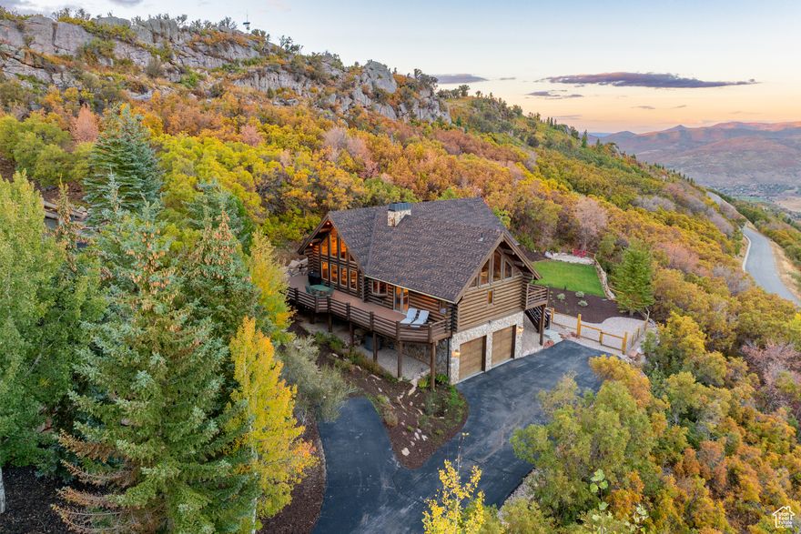 Escape to this Alps-inspired mountain chalet at the top of Pinebrook with unparalleled access to the outdoors, situated on a private wooded acre, surrounded by protected open space with stunning peak and valley views. This house's high perch has full sun exposure year-round, a newly terraced backyard, and an expansive, vaulted pine and light-filled great room creating a unique living experience immersed in nature. Wraparound decks and a new stone patio with fire pit extend the living space in every direction. For the outdoor athlete, access one of the only bolted local rock climbing crags just a few hundred yards away via a direct trail from the backyard, or enjoy miles of singletrack PCMR hiking and biking trails just steps from the front door. In winter, step into your skis down the block for stable and quiet backcountry touring on Murdock Peak and throughout Toll Canyon. Enjoy relaxing in front of the fireplace, showering in the new Moroccan-tiled shower, or cooking a feast in the open-concept, remodeled kitchen. Still only minutes to Park City, this sunlit, tasteful home is your gateway to the mountains.