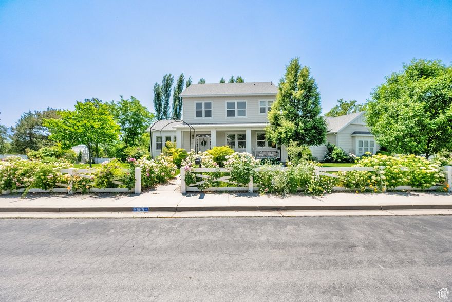 Welcome to your English Garden countryside estate, a timeless updated home with 5 bedrooms, 3.5 bathrooms nestled in a cul-de-sac, on a stunning half acre lot. Come inside where this home blends comfort and natural beauty with stylish updates that include white wash walnut hardwood floors, new carpet, neutral two-tone paint, white apron farmhouse sink, solid surface countertops, custom millwork, and handcrafted moldings throughout. The fully finished walk out basement is complete with a second kitchen, family room, two bedrooms, full bathroom, workout or potential theater room, and cold storage. Perfect for a large family, guest suite, or *INCOME APARTMENT*! A lush, meticulously landscaped yard evokes the romance of a classic English garden setting, transforming where you live, into a sanctuary and a showpiece! Velvety soft roses in multiple shades line the walkways along with numerous vibrant seasonal flowers. Charming stone paths, wisteria covered trellises, wildflower meadows, and a patio area with string lights, make for quiet enchanted evenings. Multiple fruit trees, garden beds, a green house, and cozy front porch make this a retreat of a lifetime.
