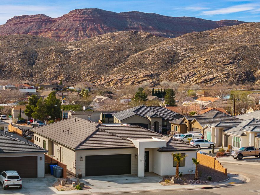 Stunning Views! Wake up to sunrise lighting the mountains and wide-open skies--elevated above the neighborhood on a premier corner lot. This custom home is part of the exclusive Builder's Reserve, the final phase of Zions Gate Estates. Oversized windows frame the scenery and flood the home with natural light, while evenings are made for the covered patio and gas fire pit. Inside you'll find floor-to-ceiling kitchen cabinetry, designer finishes, spacious rooms, and striking tilework. Pre-wired for hot tub and RV. The 24' deep garage fits a full-size 4-door pickup. No HOA. One-year builder warranty. Seller is a real estate licensee.